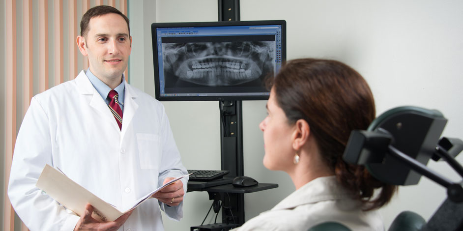 Photo of Patient Asking Questions to Oral Surgeon